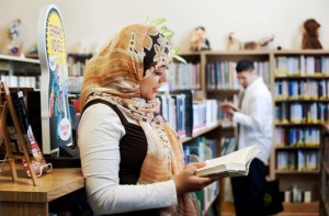 Image of Ariana Hussain and Imad Hussain at a children's library.