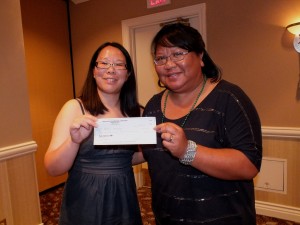 Gerie Ventura receives the APALA Travel Grant award from APALA President (2013-2014) Eugenia Beh