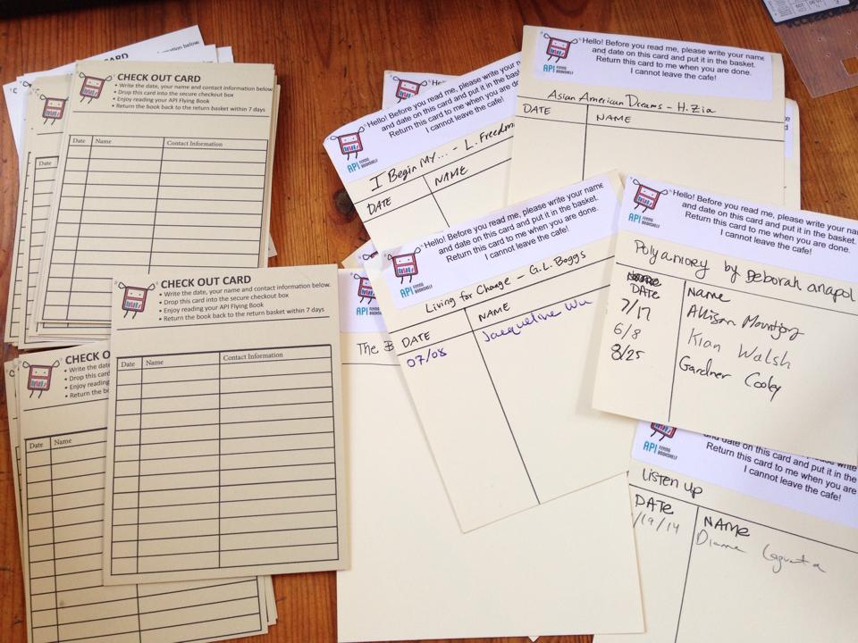 Check out cards: The newest version (left) replaces the original cards (right), and captures the date and borrowers' names and contact information.