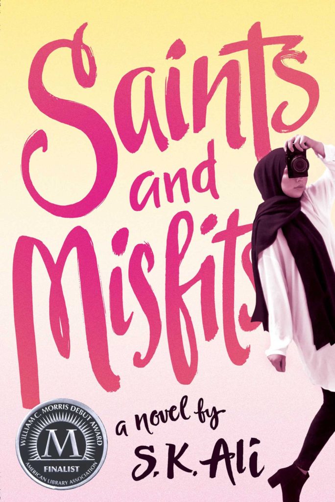 cover of the novel "Saints and Mistfits" shows a teenager in hijab holding a camera