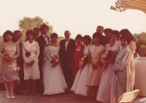 Group photo of people standing at a wedding.