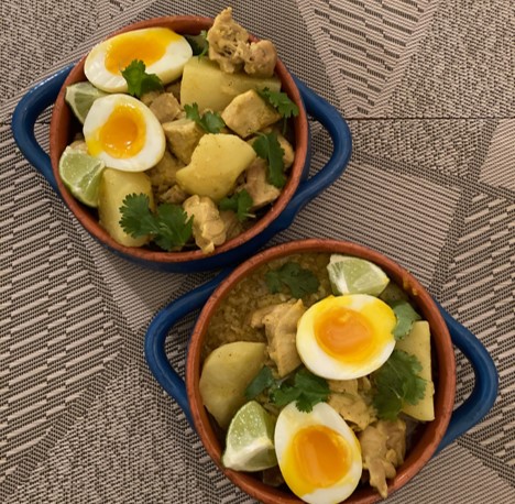 Two bowls of kuku paka, or coconut curry chicken