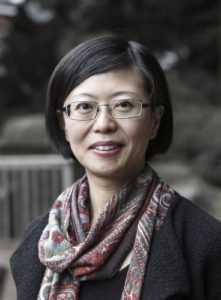Bust length portrait of Hana Kim, wearing a scarf