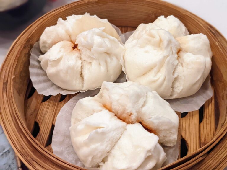 Pork buns in a bamboo steamer