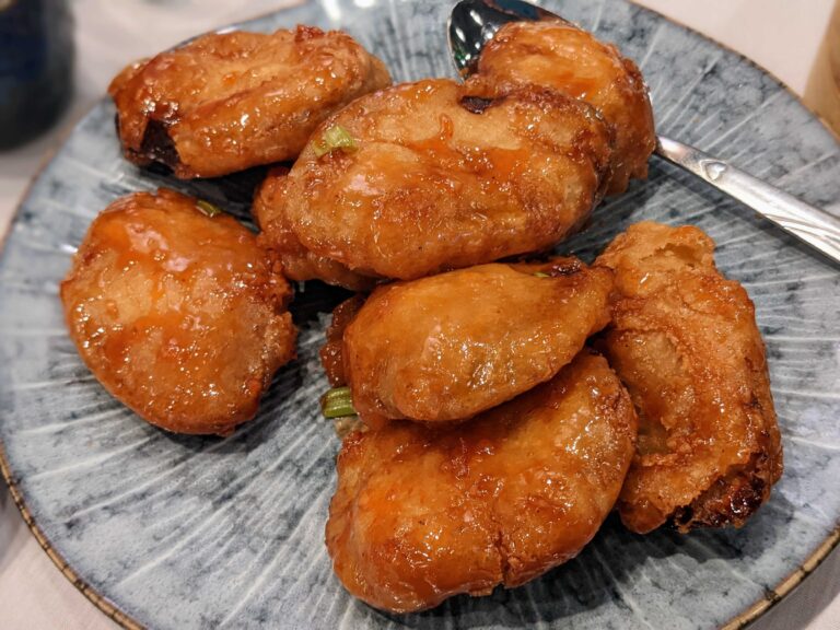 Fried eggplant on a light blue plate