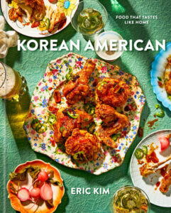 Cover of the cookbook "Korean American." Floral plate of chicken, green background.