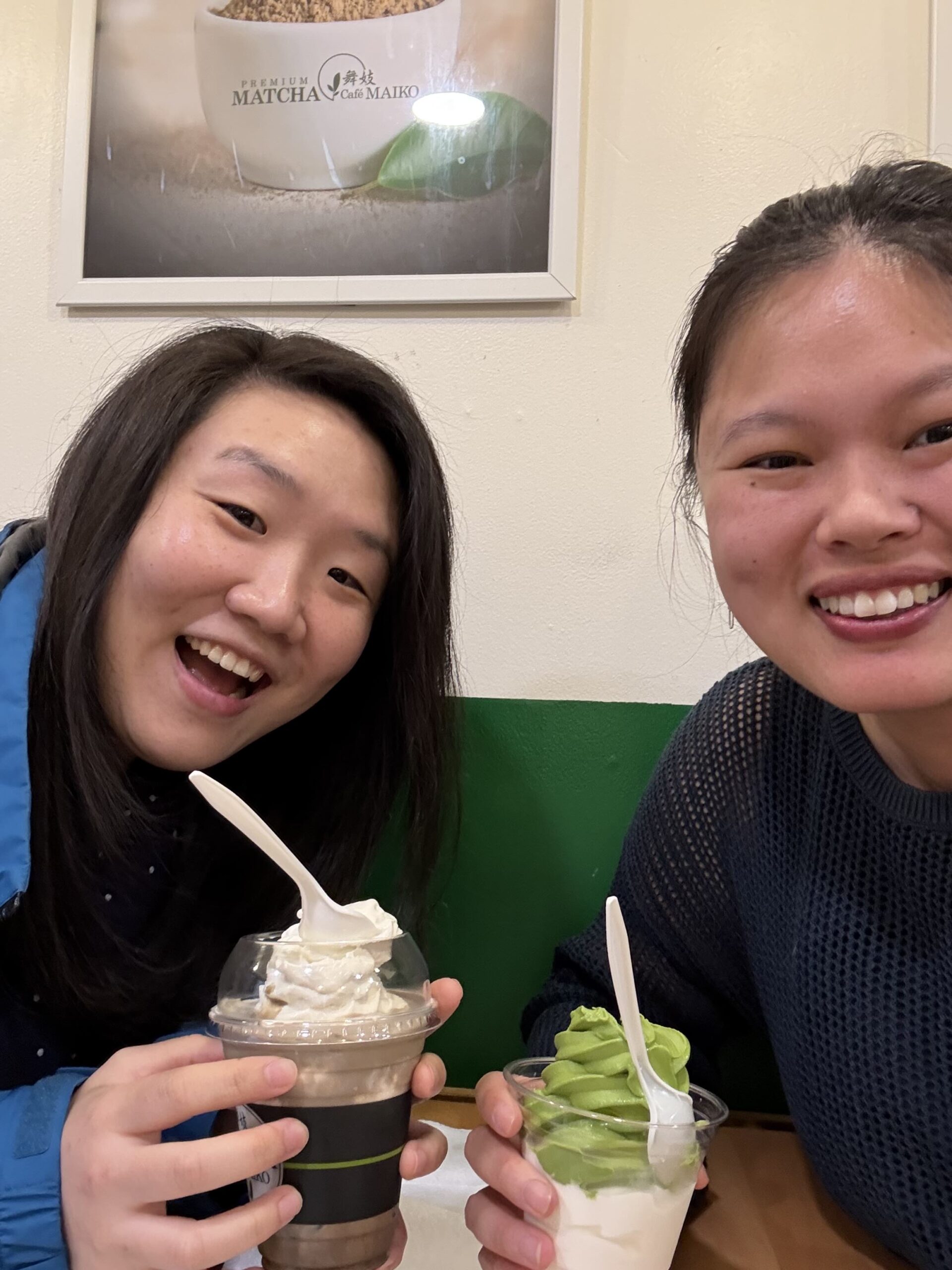 Mentor Maya Bergamasco and protege Joe Lee hold sweet, icy treats and smile into the camera