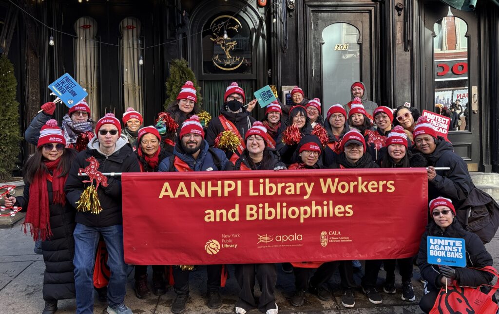 APALA Members holding up a banner preparing to march in the Lunar New Year Parade