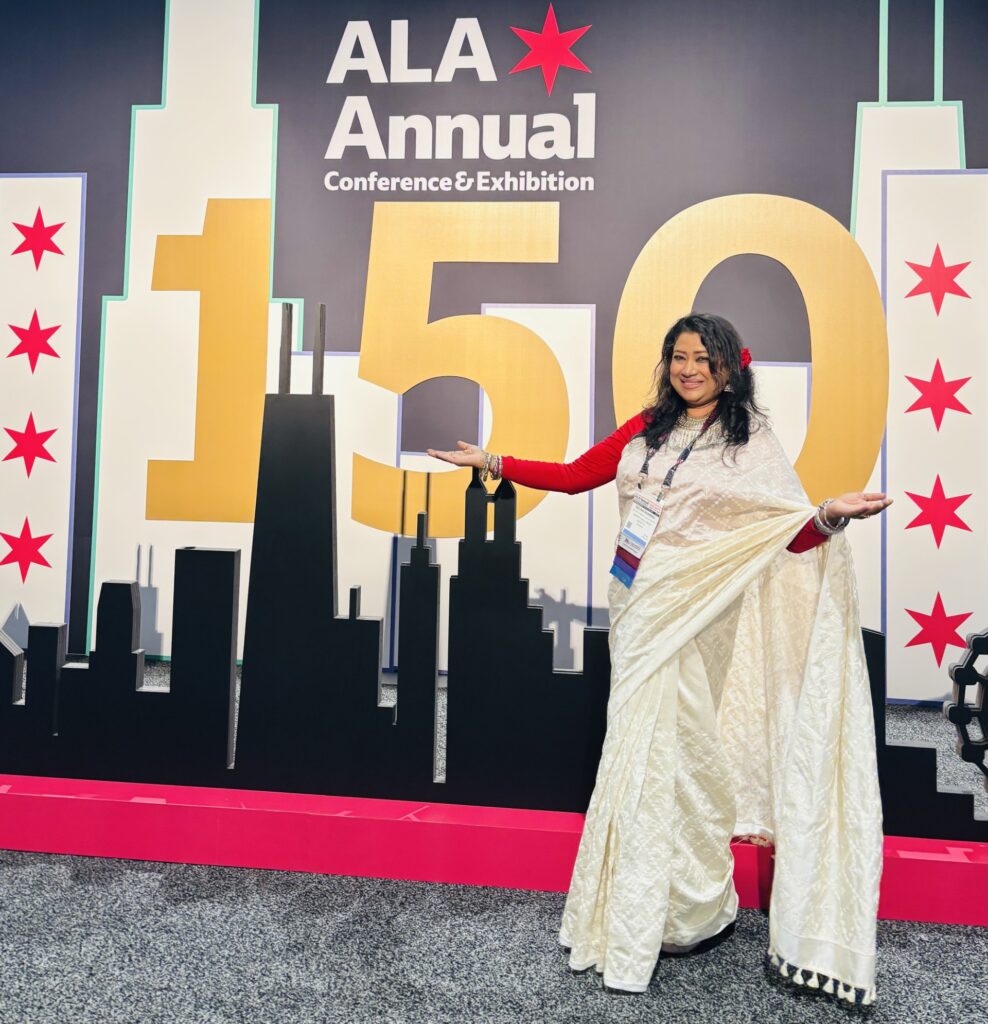 Selina Sharmin in front of the ALA Annual photo background